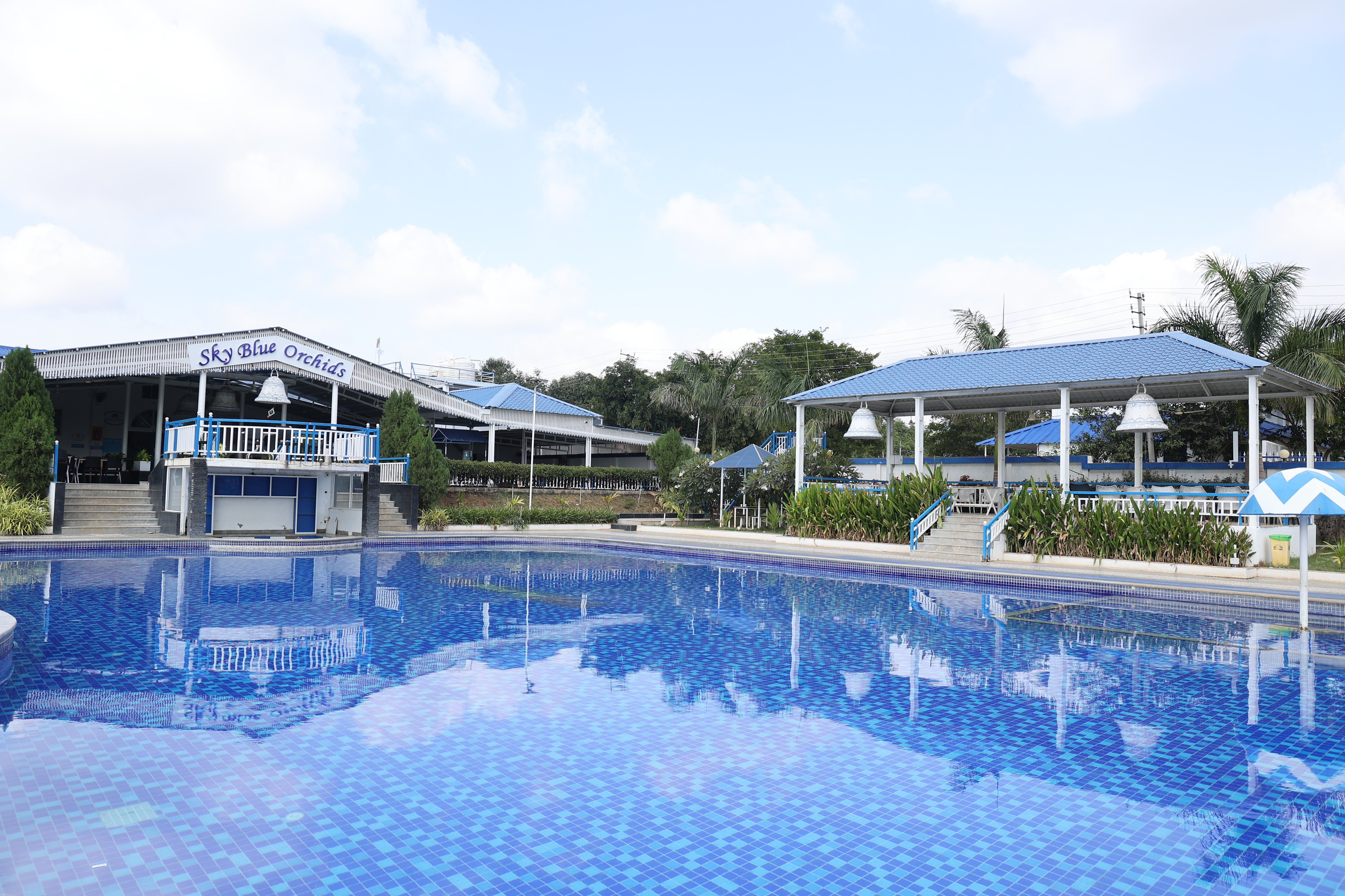 Indulge in a luxurious studio suite featuring a private pool and modern comforts in Bangalore
